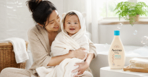 Baby enjoying bathtime with Aveeno baby hair and body wash