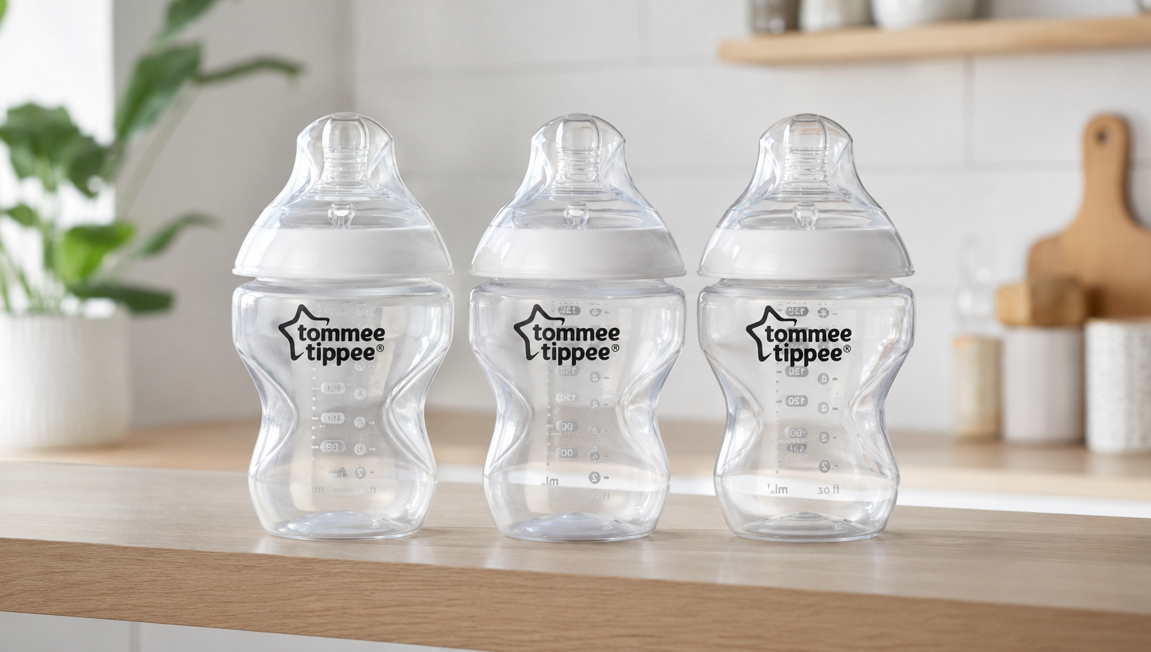 Tommee Tippee Closer to Nature baby bottles 3 pack on a kitchen shelf